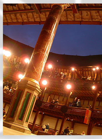 intermission at the globe... the steady lights, a concession to pragmatism, surround the stage...