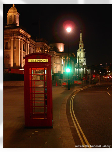the red phone booth by lamplight, outside of the National Gallery