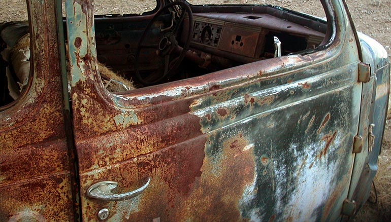 a car rusts near an abandoned mine, near Main Street, Randsburg, California