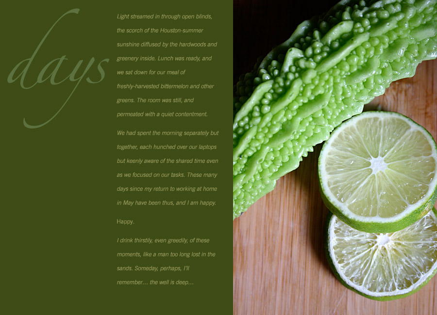 a bittermelon and slices of lime on a cutting board