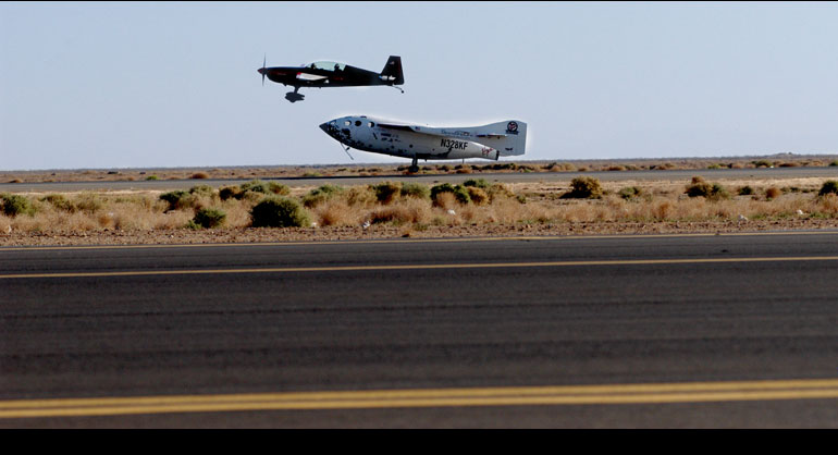 Spaceship One on final approach, as a chase plane flies in close formation